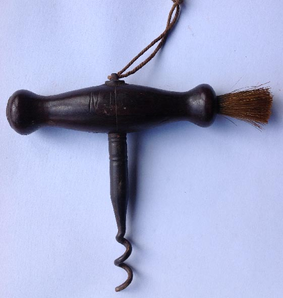 antique corkscrew with horse hair brush
